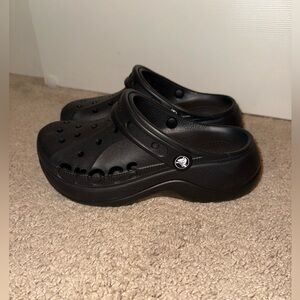 Women’s black platform Crocs, size 6.